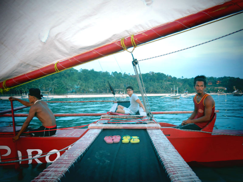 Evan Sitting on Red Pirates Paraw in the sea