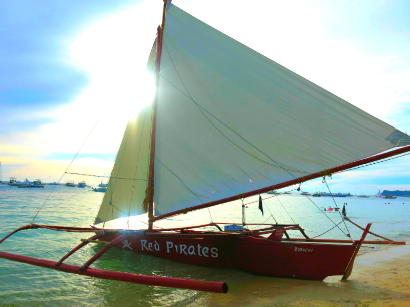 Red Pirates Paraw parked on beach