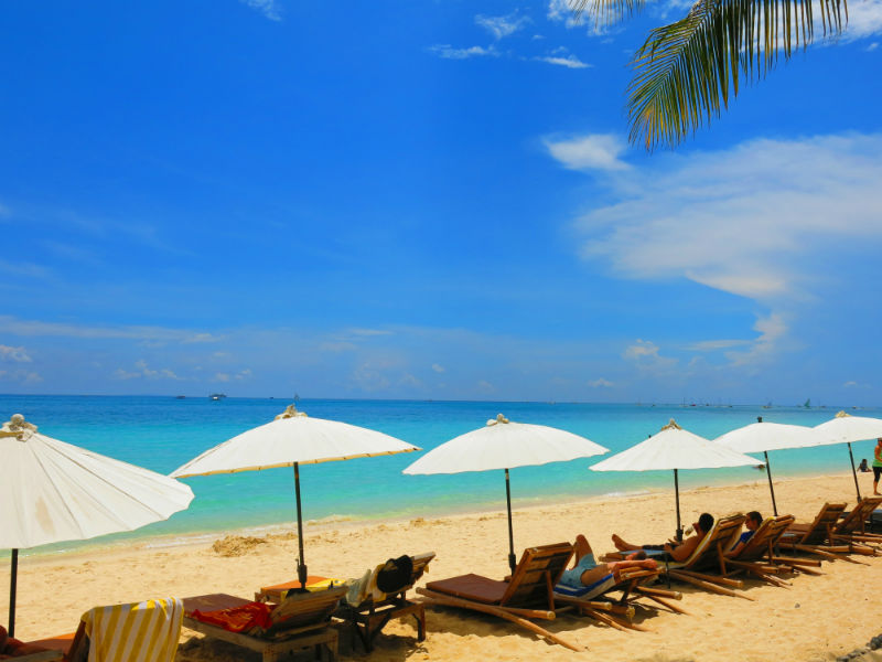 Row of Lounge Chairs along White Beach