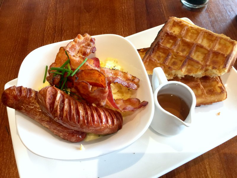 Monniker Scrambled Eggs and Bacon on Waffles with Sausages